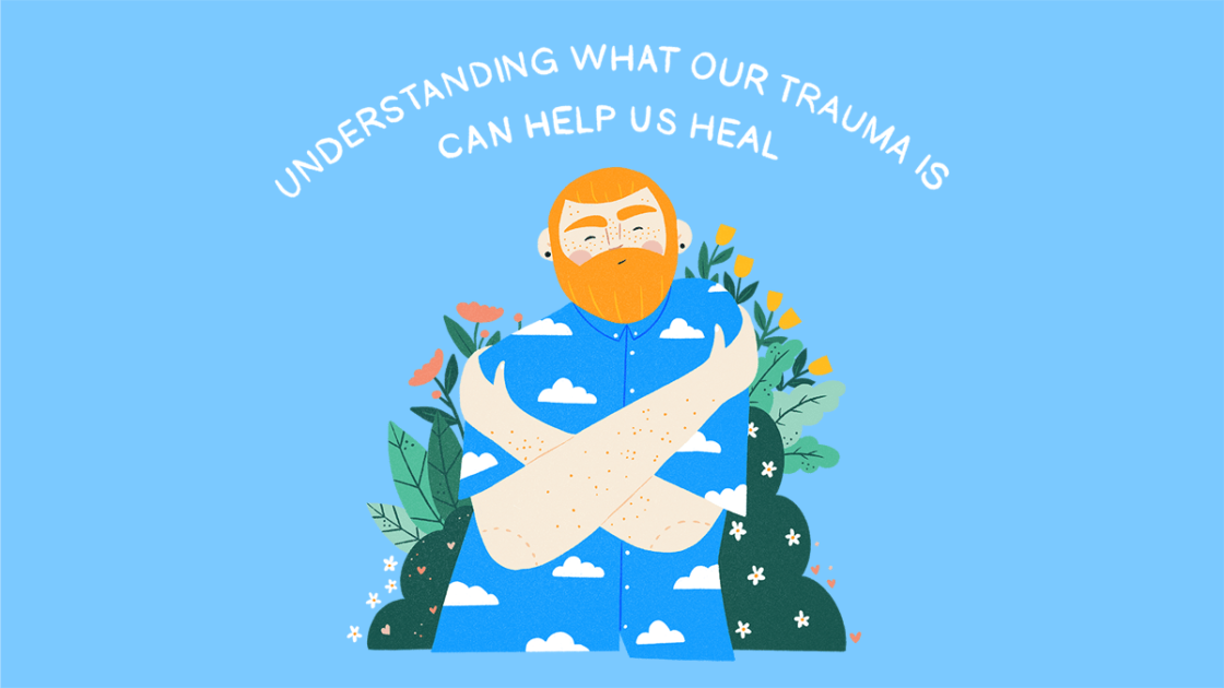 A person with ginger hair wearing a blue shirt with clouds on it hugging themselves, surrounded by flowers and greenery. Above them in white letters reads, Understanding what our trauma is can help us heal.